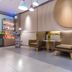 Home Inn Neo Lanzhou City Museum Dongfanghong Plaza Wanxiang City lobby seating area with modern lounge chairs
