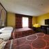 Super 8 by Wyndham Jacksonville guest room with two beds, TV, desk and chair