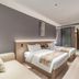 Beijing Lian Jie Hotel in Beijing guest room with two beds, sofa, and sliding glass partition