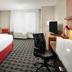 TownePlace Suites by Marriott Danville guest room with king bed, desk, chair and window view