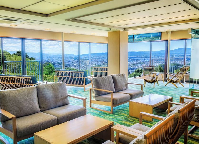 Mikasa Ryokan in Nara lounge with floor-to-ceiling windows and panoramic city views
