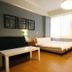 Light Morning in Yuchi Township guest room with bed, sofa, table, and large window