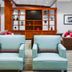 Four Points by Sheraton Raleigh Durham Airport lounge with armchairs and built-in shelving in Morrisville