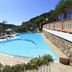 Poolside view at Albergo Ristorante San Matteo in San Bartolomeo al Mare with lounge chairs and hillside backdrop
