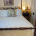 Terrell House B&B in Burnsville bedroom with four-poster bed and bedside lamps