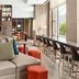 Home2 Suites by Hilton Chicago McCormick Place lounge with seating, worktables and large windows in Chicago