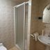 Contact Hôtel les Platanes Villeneuve sur Lot Centre bathroom with shower, sink, and tiled walls