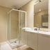 UNA Hotels Le Terrazze Treviso Hotel & Residence bathroom with shower, toilet and vanity in Villorba