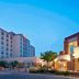Courtyard by Marriott Pueblo Downtown exterior at dusk with parking lot and illuminated entrance in Pueblo