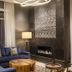 Hyatt Place South Reno lounge with blue sectional sofa, fireplace and floor lamp in Reno