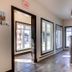 Hotel Marineau Shawinigan lobby reception area with tiled floor and large windows