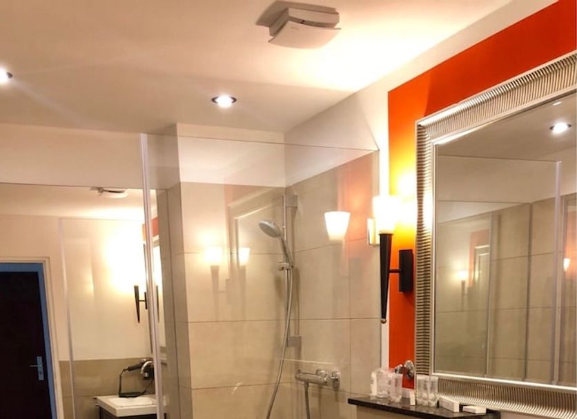 Hotel Ramor Garni in Duisburg bathroom with walk-in shower, vanity, sink and toilet