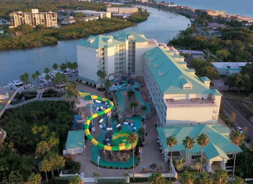 Harbourside Resort, Indian Rocks Beach, aerial view of resort by the water with pool and palm trees