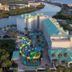 Harbourside Resort, Indian Rocks Beach, aerial view of resort by the water with pool and palm trees
