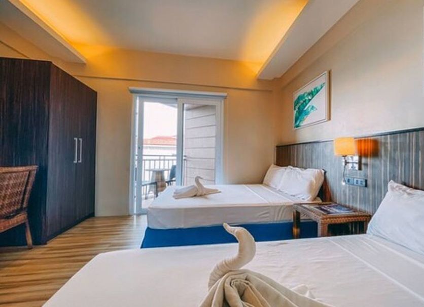 Brisa Marina Beach Resort powered by Cocotel in Morong, twin-bed room with balcony and sea view