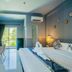 The Rubber Hotel (Sha Plus+) guest room with balcony view in Thep Krasattri