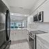 Bridgewalk, a Landmark Resort in Bradenton Beach kitchen with stainless appliances and white cabinets