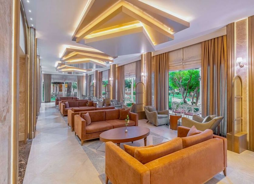 Papillon Ayscha Resort & Spa in Belek lounge with modern seating and large windows