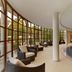 Sheraton Mallorca Arabella Golf Hotel indoor pool with curved windows and lounge chairs in Palma de Mallorca