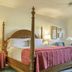 Sea Cliff Gardens Bed & Breakfast in Port Angeles, four-poster bed with ocean-view window and balcony