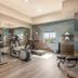 Candlewood Suites Kenedy By IHG fitness center with exercise bikes, treadmill, weights and window view