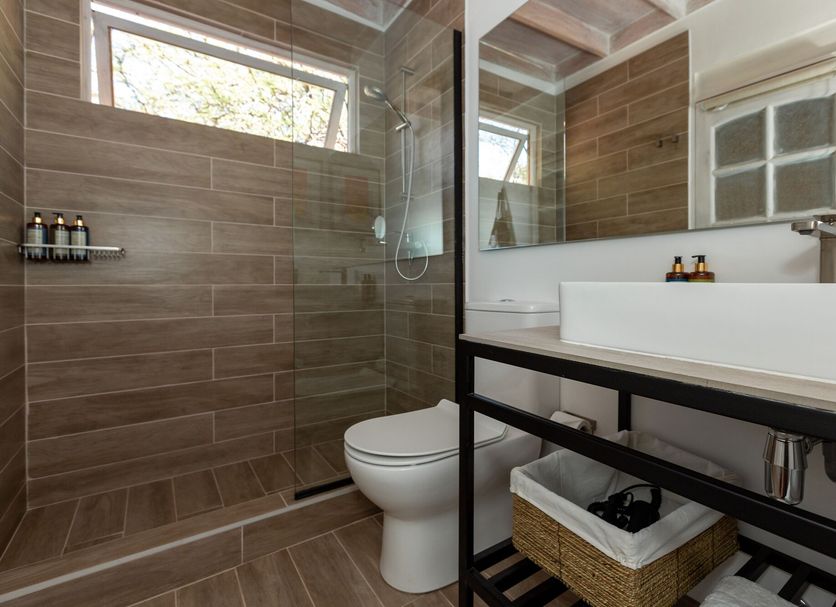 Casa Solcor Boutique Bed & Breakfast bathroom in San Pedro de Atacama with walk-in shower and modern sink
