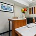 Holiday Inn Express & Suites Ada By IHG computer station with desks, printers and wall art in Ada