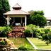 Gem Beach Resort in Kuala Terengganu with a garden pond and gazebo walkway