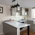 Broom Hall Inn in Alcester kitchen with island, white countertops, pendant lights and farmhouse sink