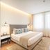 Vip Executive Picoas Hotel in Lisbon guest room with queen bed, desk, chairs, and large window