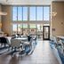 Comfort Inn Aikens Center Martinsburg lobby seating area with large windows and TV
