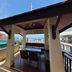 Jomtien Beach Penthouses in Pattaya rooftop terrace with seating, pool and sea view