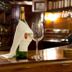 Wine bottle and glass on a bar at Constellation Hotel in Port Au Prince
