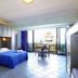 Oasi Azzurra in Villafranca Tirrena: sea-view guest room with balcony and blue bedspread