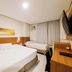 Hotel Itamarati Centro-República room in Sao Paulo with two beds, desk and wall-mounted TV