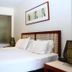 Private Sea Temple Studio King Studio 423 in Palm Cove bedroom with king bed and framed wall art