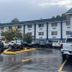 Quality Inn and Suites Morgantown - University Area exterior with wet parking lot and parked cars