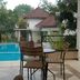 Seulawah Resort And Cafe in Batu with outdoor pool, patio seating, and a garden view