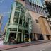Nina Hotel Causeway Bay in Hong Kong, exterior of modern glass high-rise hotel on city street