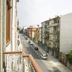 Bo - Álvares Cabral Guesthouse balcony view over a Porto street with parked cars and nearby buildings