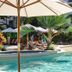 Private Sea Temple Studio King Studio 423 in Palm Cove, pool with palm trees and sun loungers