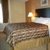 Hotel Brownsville Brownsville guest room with king bed, bedside lamps, and window
