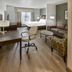 Best Western Plus Duncanville Dallas guest room with bed, sofa, desk and kitchenette sink