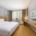 Shanshui Trends Hotel (Universiade Sports Center) Chengdu guest room with king bed, desk and window seating