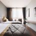 Spice House Chiang Mai guest room with twin beds, wall-mounted TV and city-view window