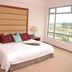 Oriental Crystal Hotel in Kajang guest room with king bed and large window overlooking the city