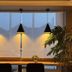 Hôtel L'Europe in Cholet lounge with window seating, pendant lights, and a potted palm