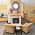 Cobblestone Inn & Suites - Denison lobby with fireplace seating and Boulder's sign in Denison