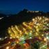 Mon Ing Dao in Mae Rim at night, with lit hillside bungalows and lush gardens