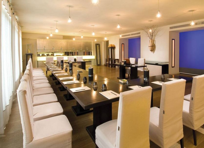Hotel Carducci 76 in Cattolica meeting room with long conference table and white chairs